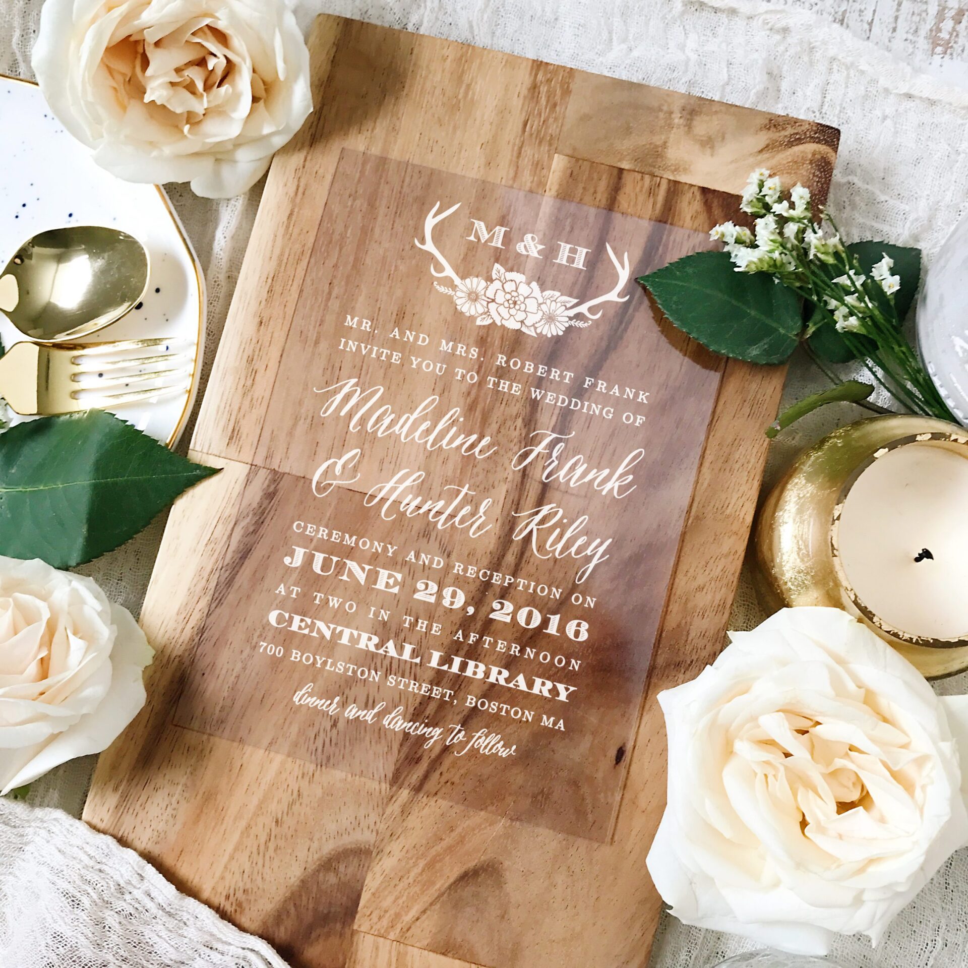 photo of a woodgrain two-scaled wedding invitation